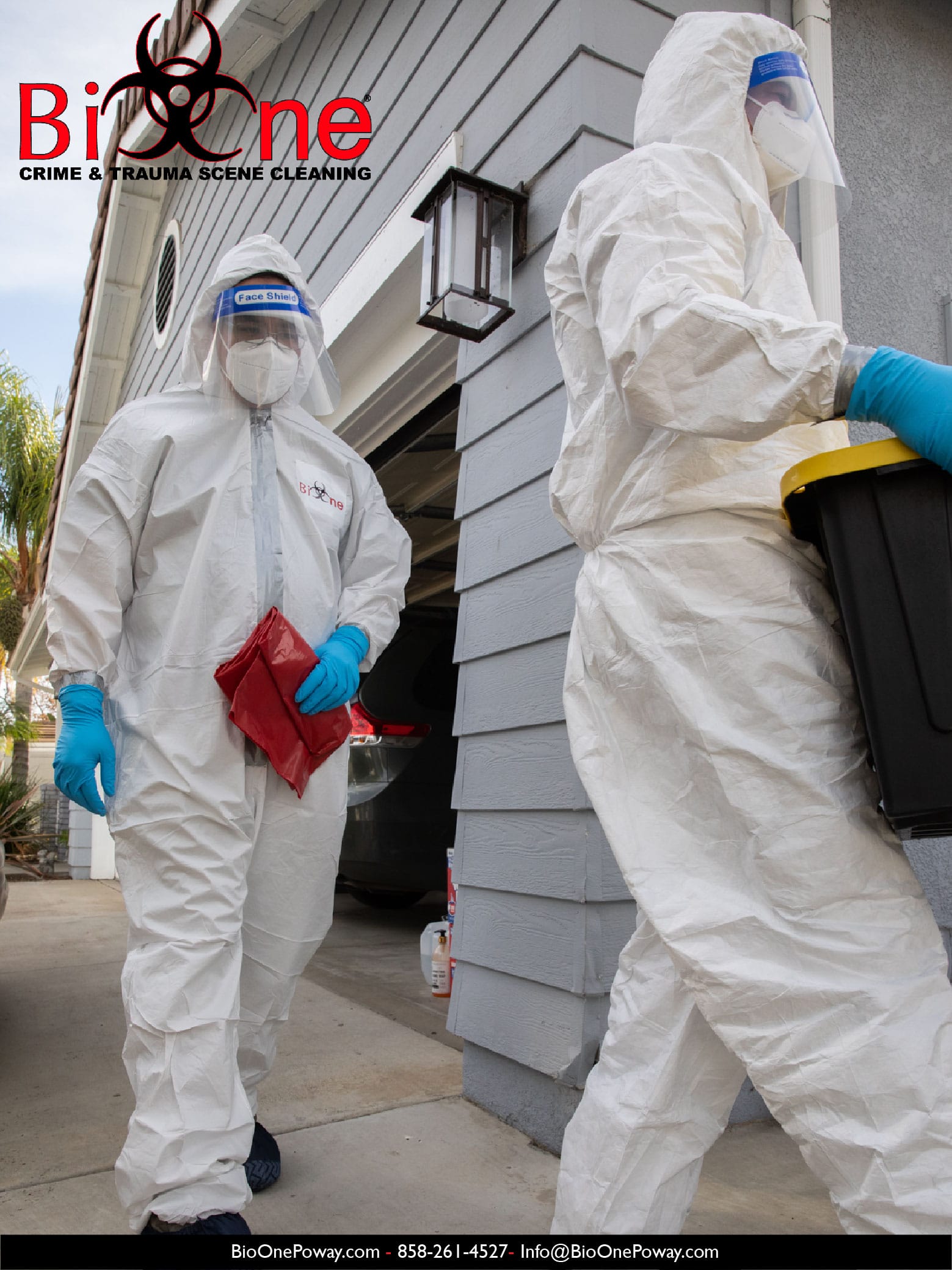 Image shows Bio-One restoration technicians fully dressed in PPE entering a house for a disinfection and decontamination service.